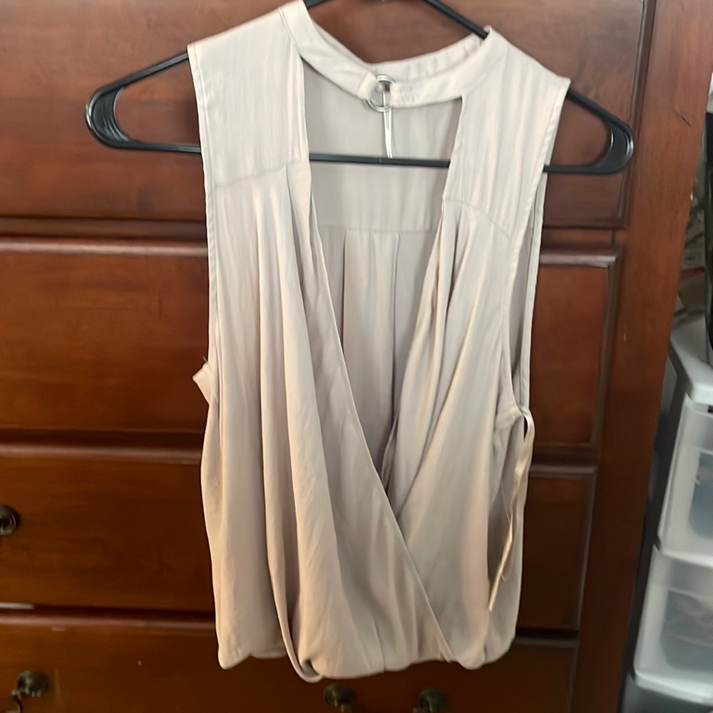 Brand new with tags. Criss cross top.